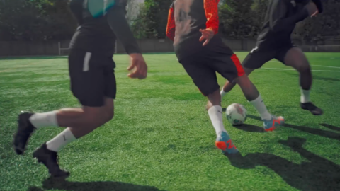 Production for the collaboration between Puma and Neymar shot on a footbal field.