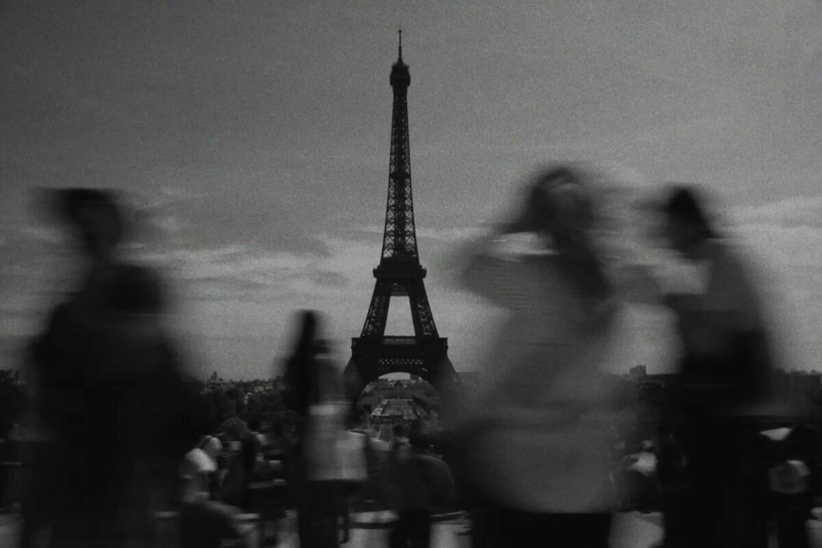 Eiffel Tower in black and white behind blurred crowds – Valorant Champions Paris film