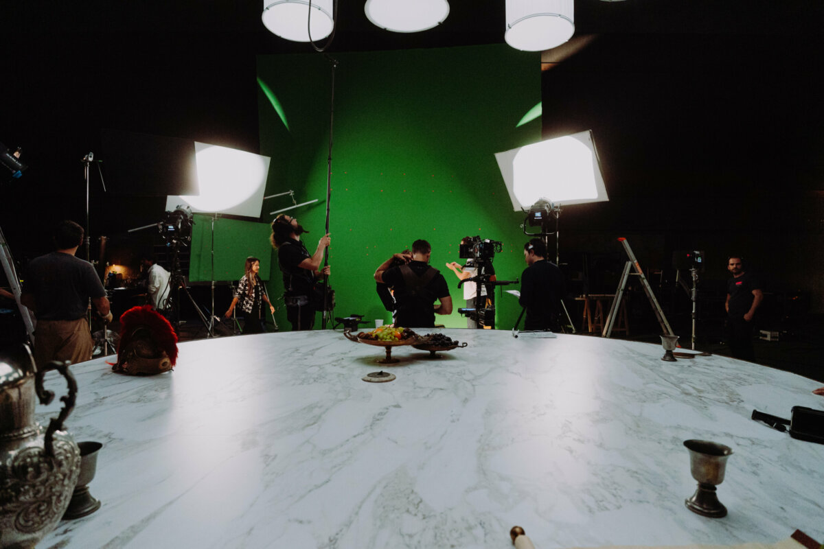 Green screen studio with a marble banquet table – Ubisoft Anno 117 shoot
