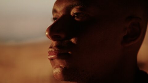 Close-up profile of Kylian Mbappé at sunset – Hublot film