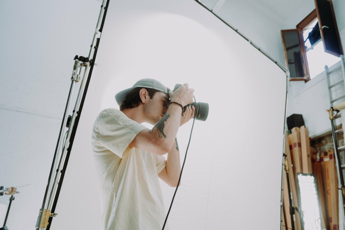 French photographer shooting on a white studio set in Paris