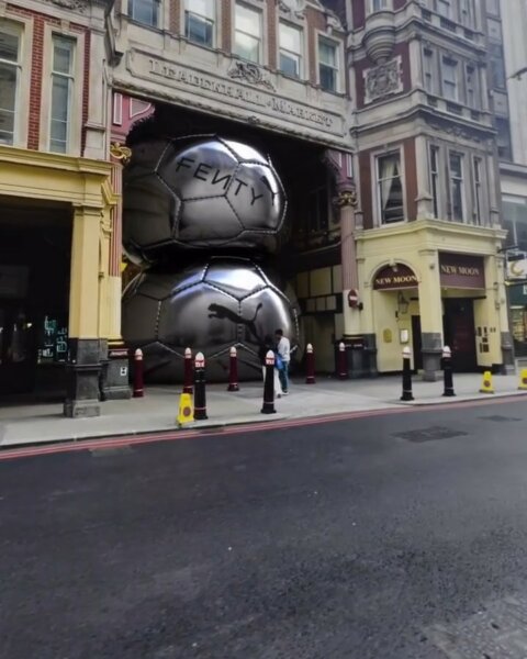 Giant chrome spheres in a street lined with Victorian buildings – Fenty x Puma CGI campaign