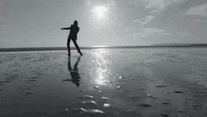 Silhouette dancing on a wet beach at sunset – Rahim Redcar “To Be Honest” music video