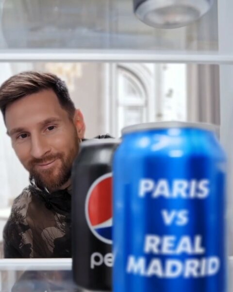 Lionel Messi smiling next to a Pepsi “Paris vs Real Madrid” can – Pepsi social media content