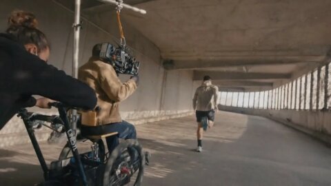 Tracking shot from a wheelchair rig in a covered walkway – Nike x Intersport behind the scenes